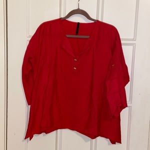 Red blouse with buttoned open sleeve